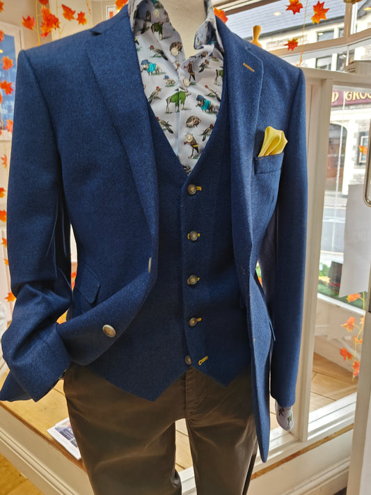 Bright blue tweed with yellow stitching by Mazzelli
