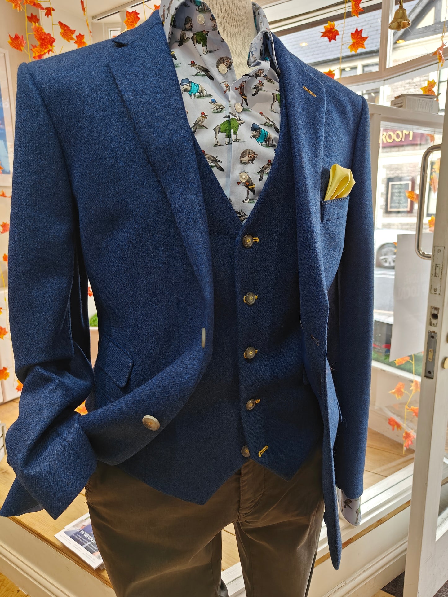 Bright blue tweed with yellow stitching by Mazzelli